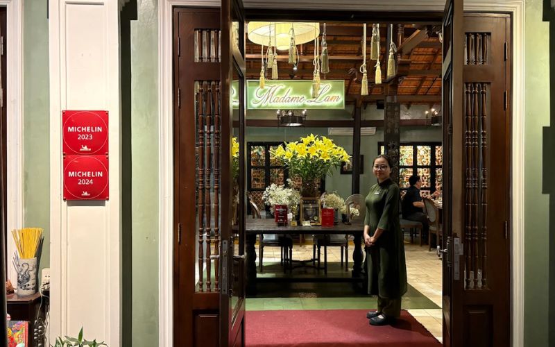 Madame Lam entrance featuring its Michelin recognition plaques
