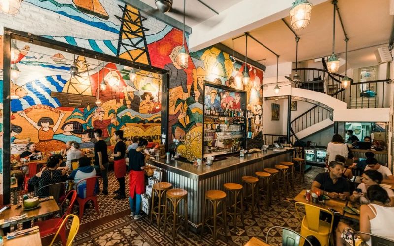 A modern Vietnamese restaurant space with distinctive artistic details