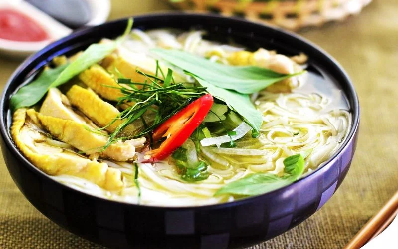 Harmonious ingredients coming together to create a complete bowl of chicken pho