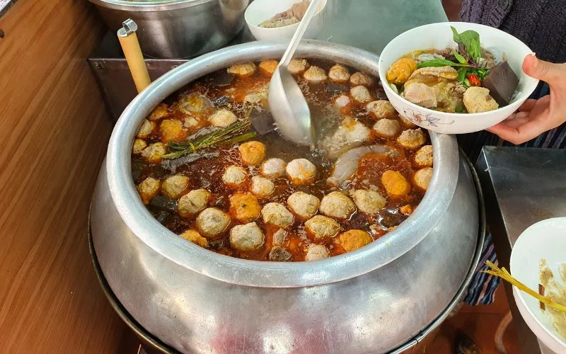 The Bun Bo broth is simmered from bones, lemongrass, and signature spices